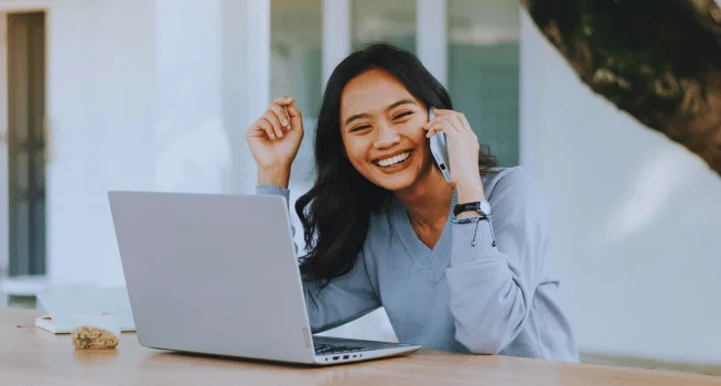 Woman Smiling While Talking On The Phone - kohe Dental